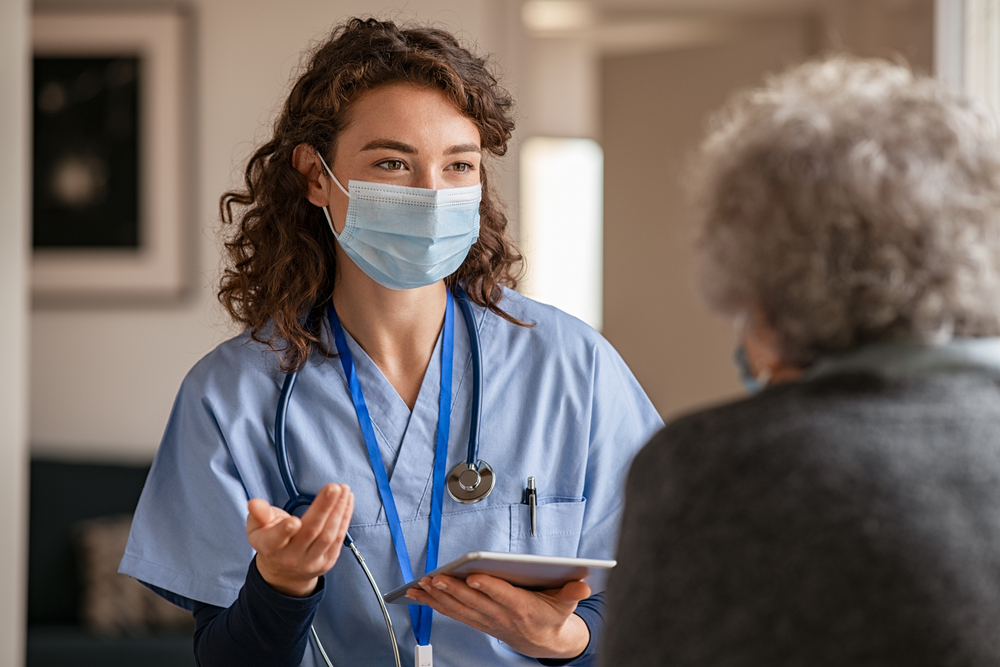 A female HCP talking to her patient