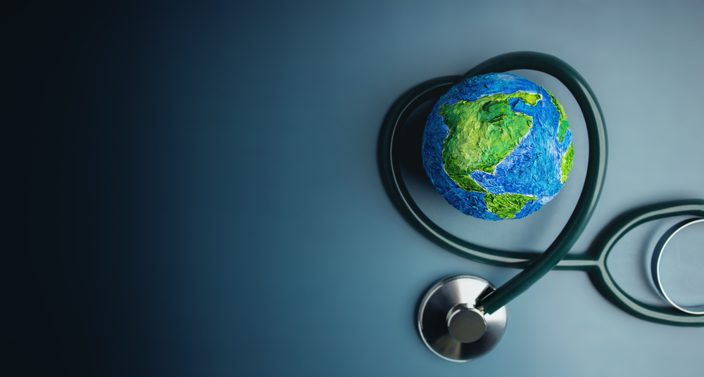 An earth surrounded by a stethoscope