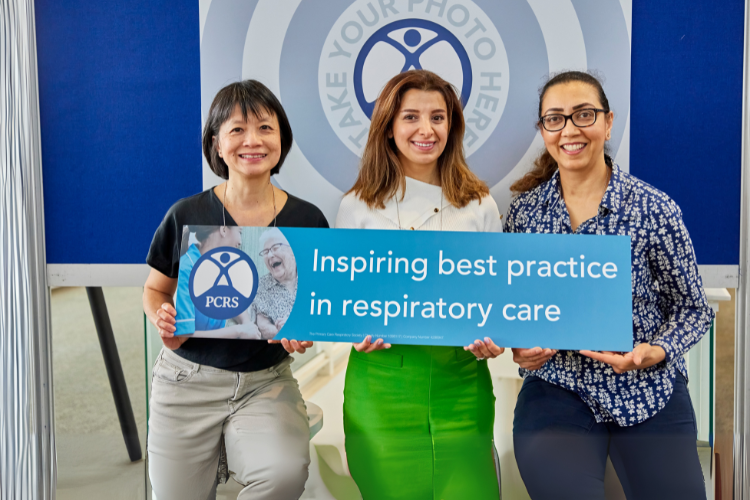 Members holding PCRS strapline "Inspiring best practice in respiratory care"