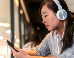 Woman listening to podcast