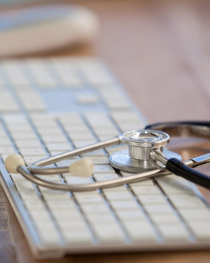 A computer keyboard and stethoscope