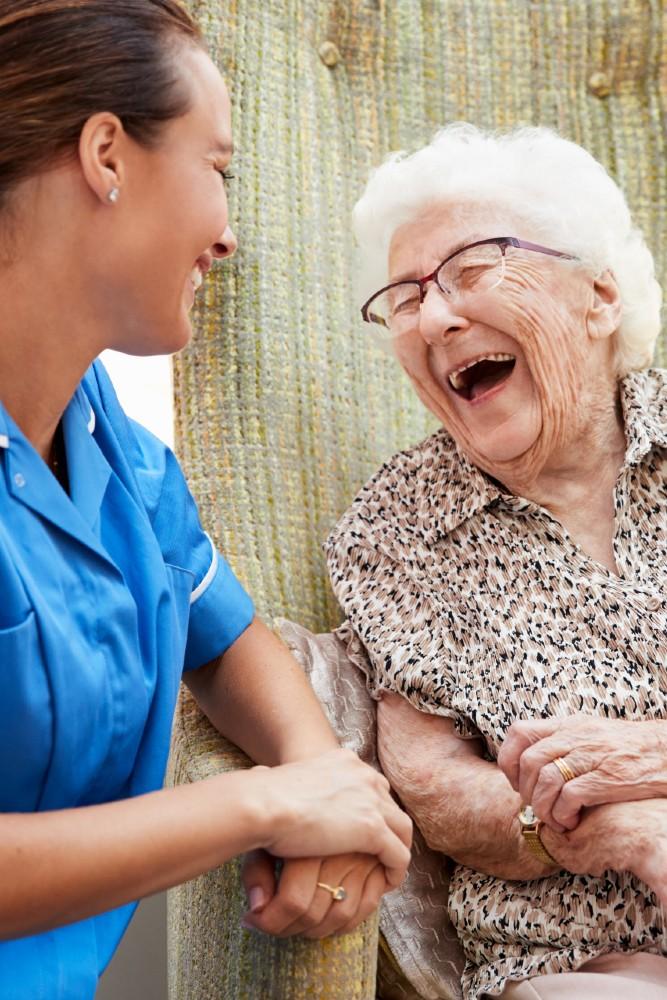 A HCP smiling with an older person