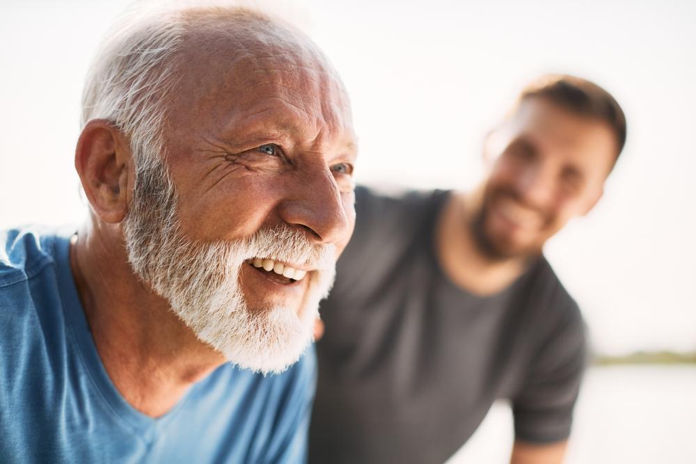 An older and younger man exercising together