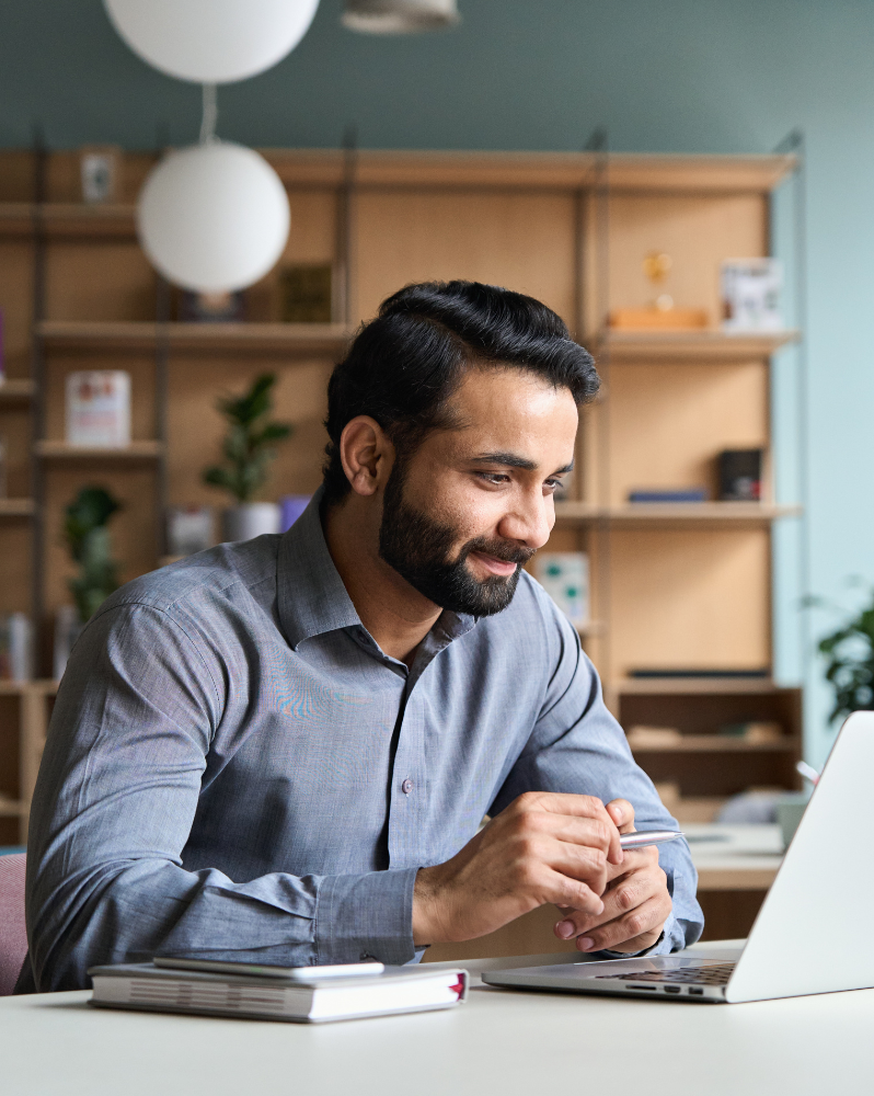 Man learning online using laptop