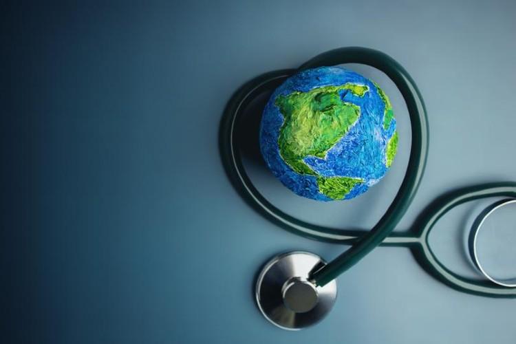 An earth surrounded by a stethoscope