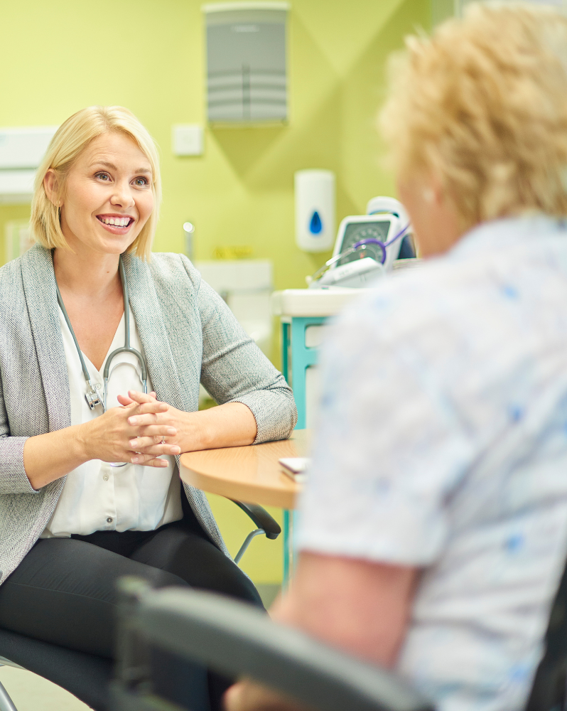 GP listening to a patient at a healthcare appointment