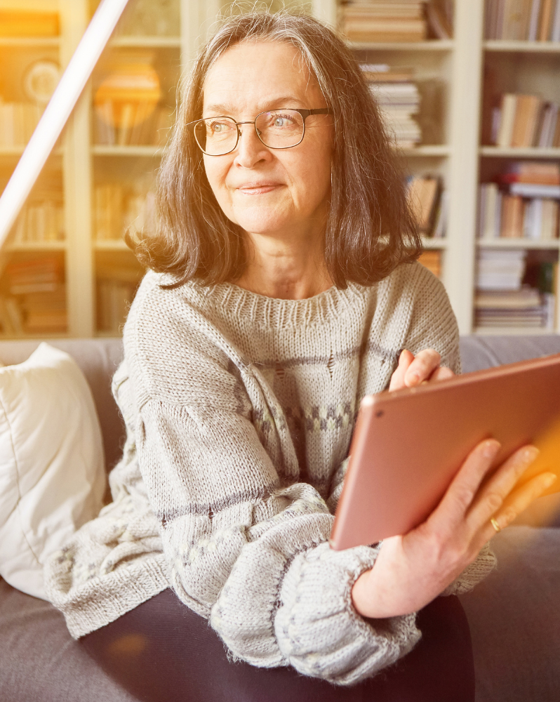 Woman holding tablet in hand