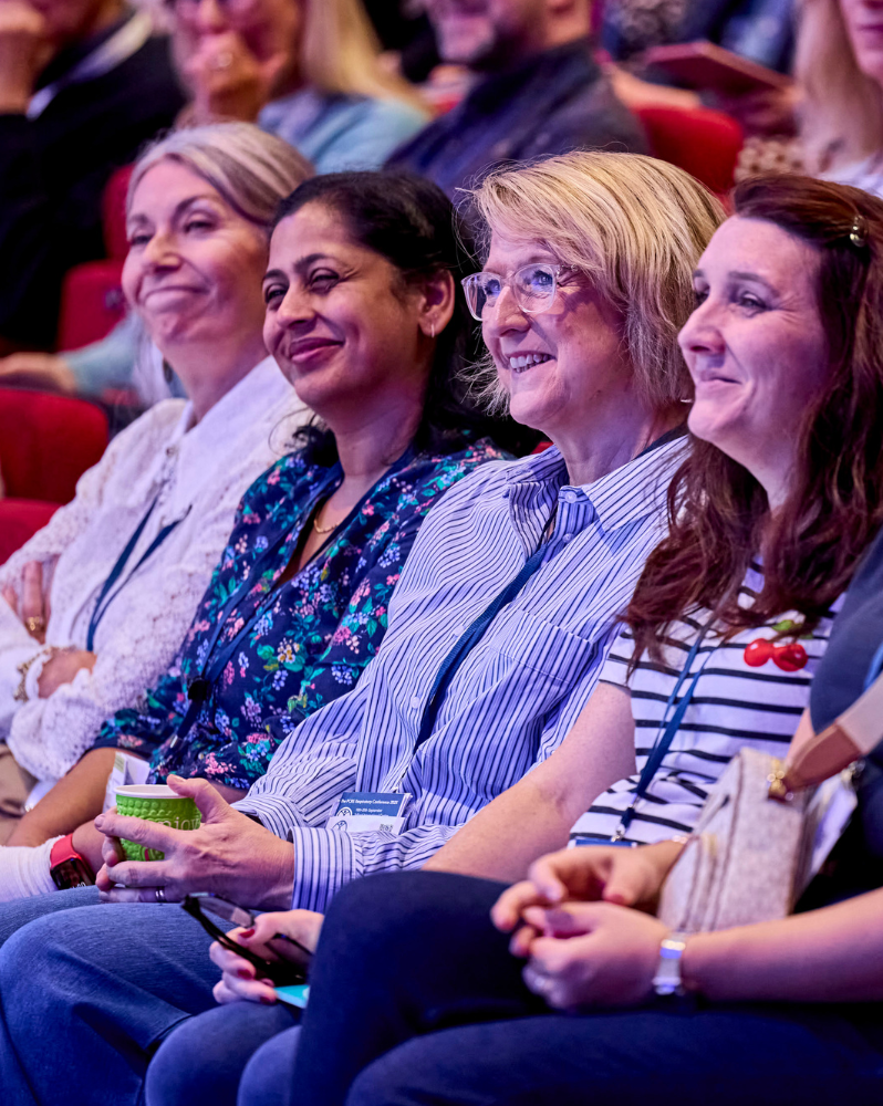 Plenary attendees smiling