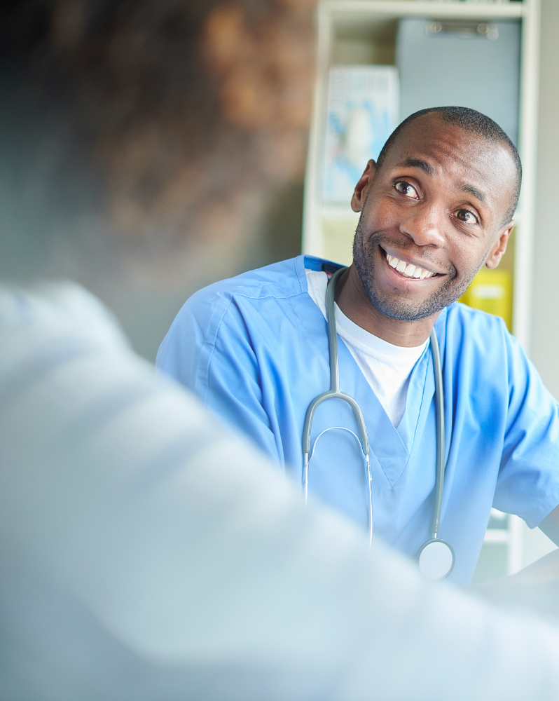 An NHS Healthcare Professional with a patient