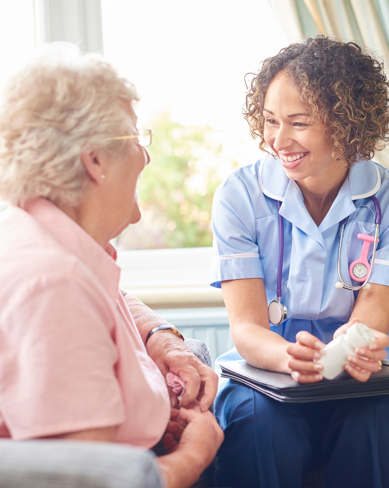An NHS nurse talking with a patient about medication